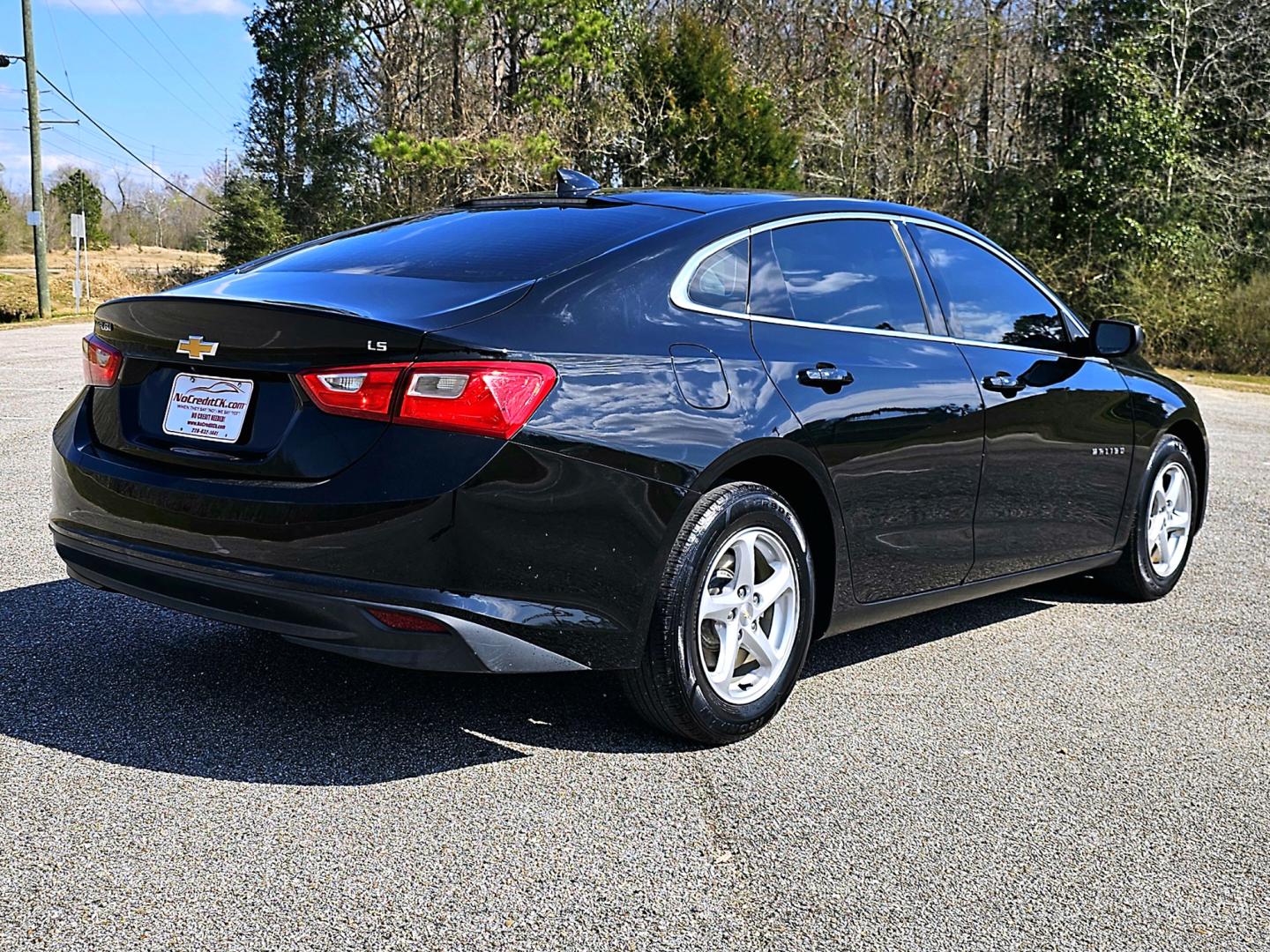 2016 Black Chevrolet Malibu LS (1G1ZB5ST4GF) with an 1.5L L4 DOHC 16V engine, 6A transmission, located at 18001 Kellogg Rd, Saucier, MS, 39574, (228) 832-1441, 139.421463, -76.641457 - Photo#5